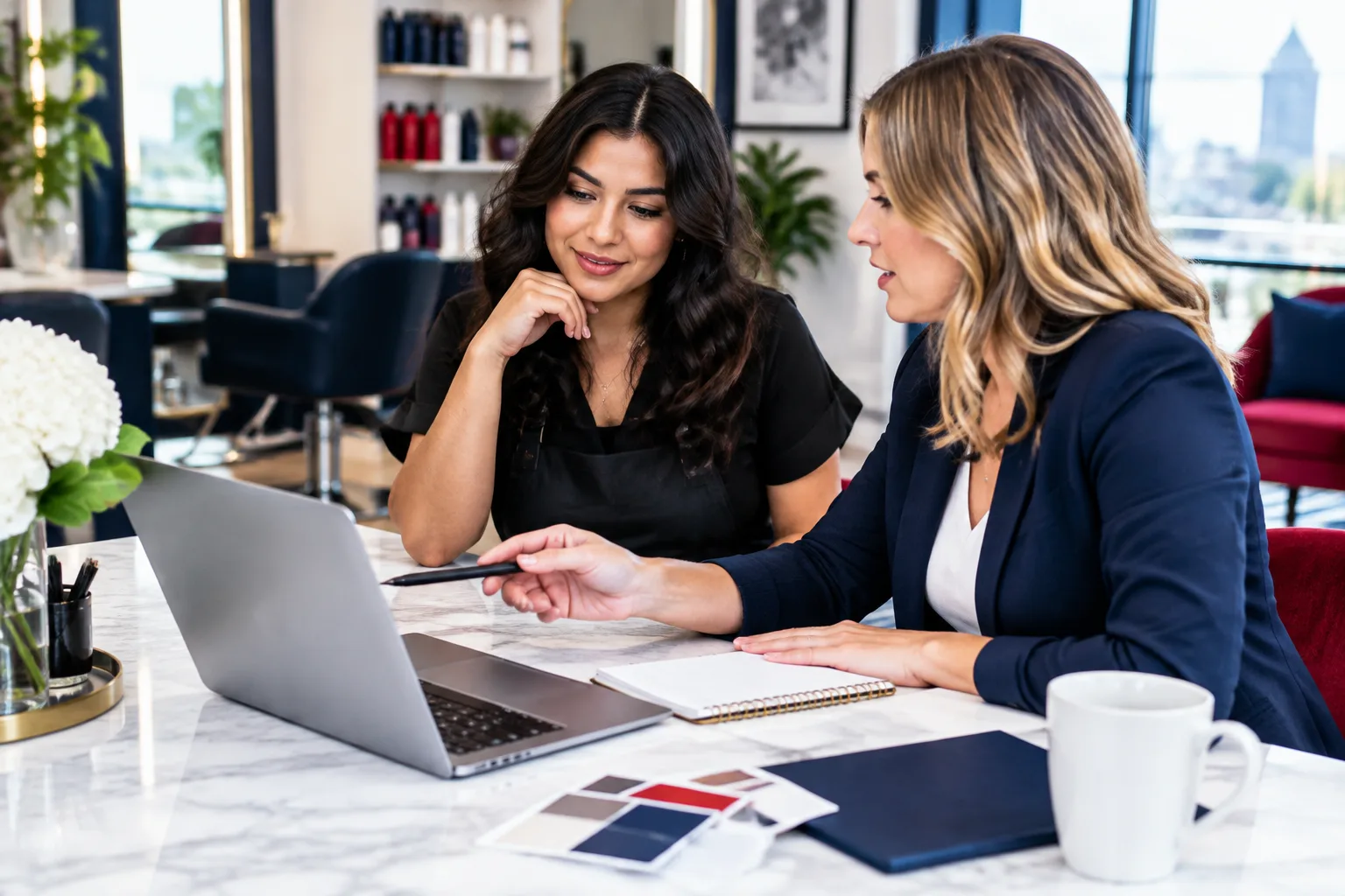Beauty salon owner discussing website and local marketing strategy with a digital studio consultant
